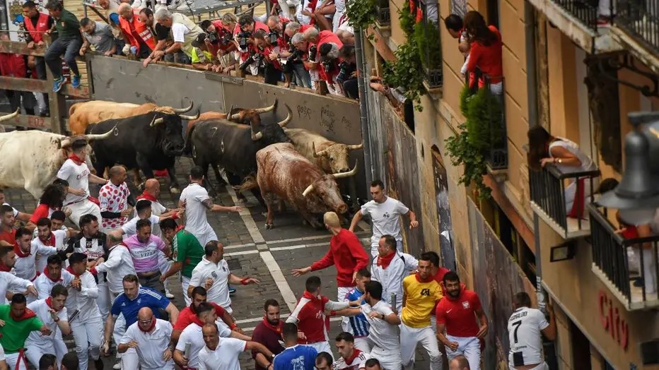 The 2022 Running of the Bulls in Pamplona, Spain. Though he is not visible in this photo, Saxon was standing close to the runner in the lower right corner of the picture wearing number seven.